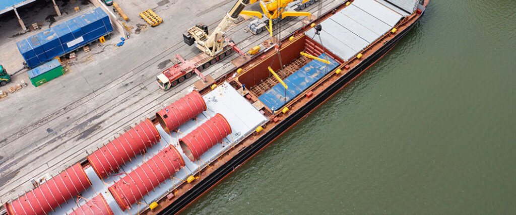 Aerial view of a dry bulk ship being loaded at a port