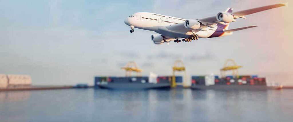 An airplane flying past a port